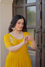 Yellow Faux Blooming Designer Round Neck Embroidery Work Gown
